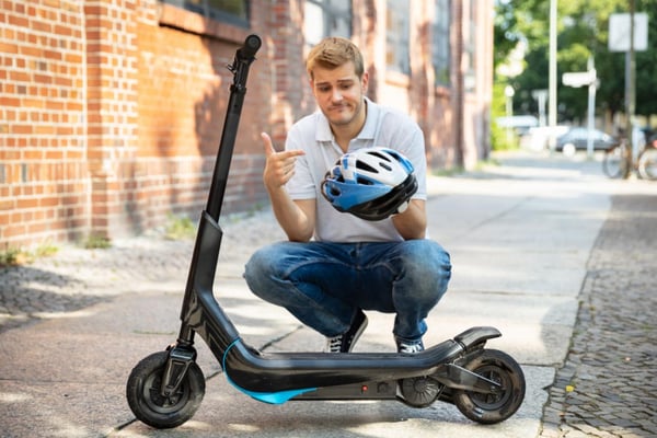 Man pointing at a helmet
